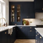 Freshly painted midnight blue kitchen cupboards with brass handles