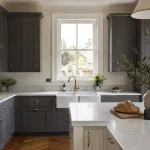 A beautiful modern shaker kitchen demonstrating professional shaker kitchen design tips with two-tone cabinetry.