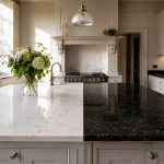 A side-by-side comparison of quartz vs granite worktops installed in a luxury kitchen.